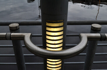 Modern Steel Illuminated Lamppost and Steel  Handrail on Riverside Path