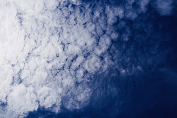Clouds in clean blue sky.