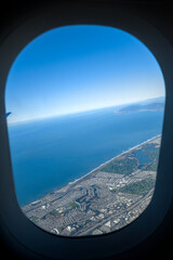 View from the plane window on the coast of Pacific Ocean