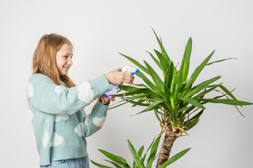 Girl Enjoying Watering Houseplant with Spray