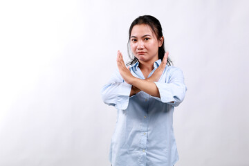 Portrait of young asian woman showing stop, cross prohibition sign, forbid smth, refusing, standing...