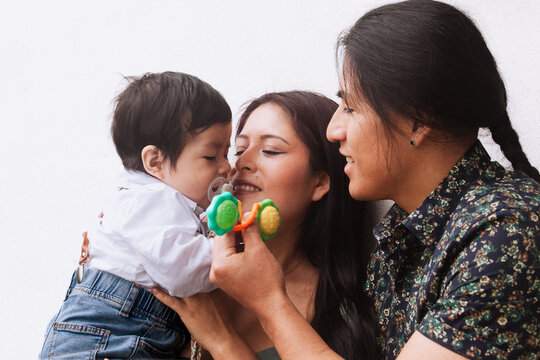 Loving family moment with parents and baby.