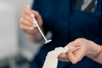 close-up in clinic young doctor ear throat nose ready to examine the patient
