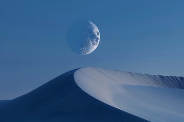 The gentle curve of a sand dune under a crescent moon