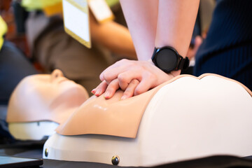 Demonstration of heart pumping through a dummy , basic emergency first aid