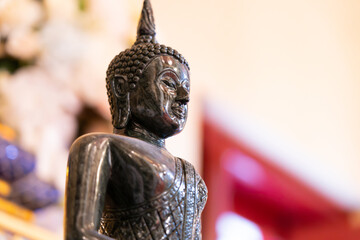 Close-up of Buddha statue in soft focus ,in a Buddhist temple in Thailand of Buddhism