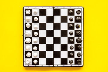 Chess piece on chess board top view. Game as competition in business or business strategy concept