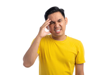 Unhealthy young Asian man suffering from headache, pressing finger to temple with pain facial expression isolated on white background