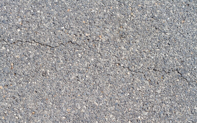 Asphalt with a little cracked texture of the road