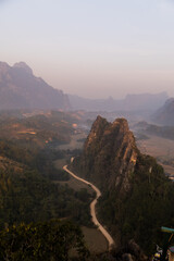 road leading through the valley at sunrise in Vang Vieng, the adventure capital of Laos