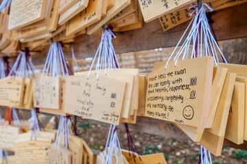 Small wooden plaques (ema) with the worshippers prayers or wishes on display at the Kiyomizu-dera...