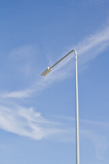 Street light pole on blue sky