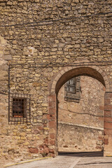 Access arch in an old yellow stone wall