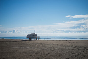 Gruissan - France - 27 April 2024 - view of wooden life guard station on the beach on beautiful cloudy sky background