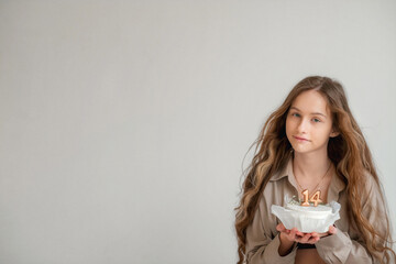 Beautiful girl with long blond hair. Teenager. It's the girl's birthday. The baby is 14 years old....