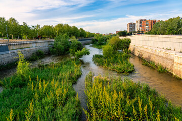 Manzanares river at sunset as it passes through the capital of Spain in Madrid