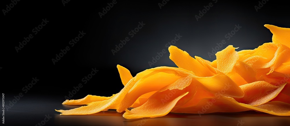 Poster a copy space image of a background showcasing a piece of dried mango