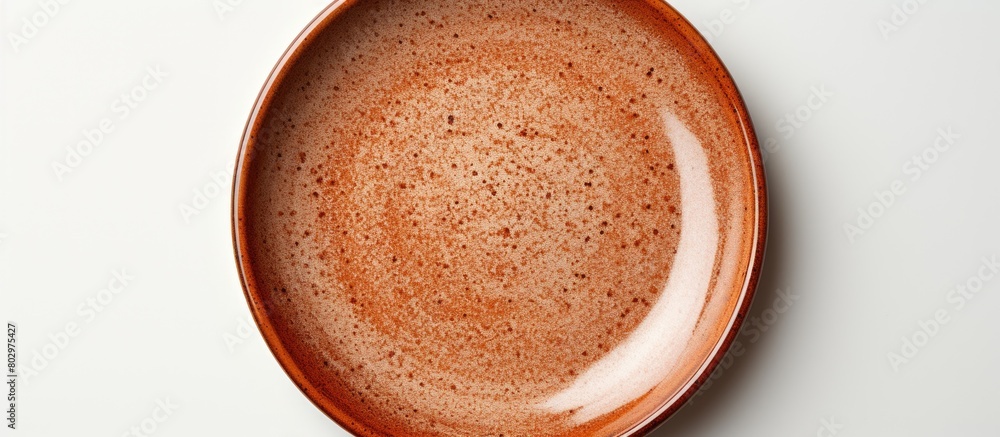 Fototapete a ceramic plate with a brown circle set on a white background is devoid of any objects with addition