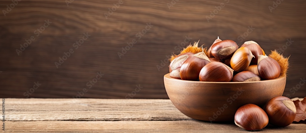 Aufkleber a copy space image showcasing a bowl of fresh chestnuts placed on a rustic old wooden backdrop