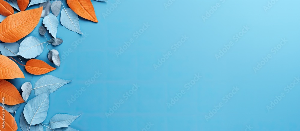 Poster A blue background showcasing school supplies and orange leaves with ample copy space for additional elements or text