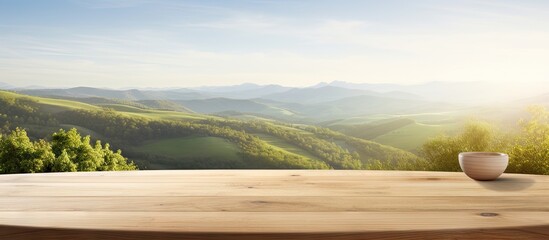 A beautifully crafted wooden table is positioned in front of a captivating landscape providing an ideal setting for showcasing and presenting products with minimal distractions Copy space image