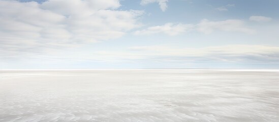 Obraz premium A chilly and breezy day at the expansive beach of Sankt Peter Ording in the German Wadden Sea featuring a captivating copy space image