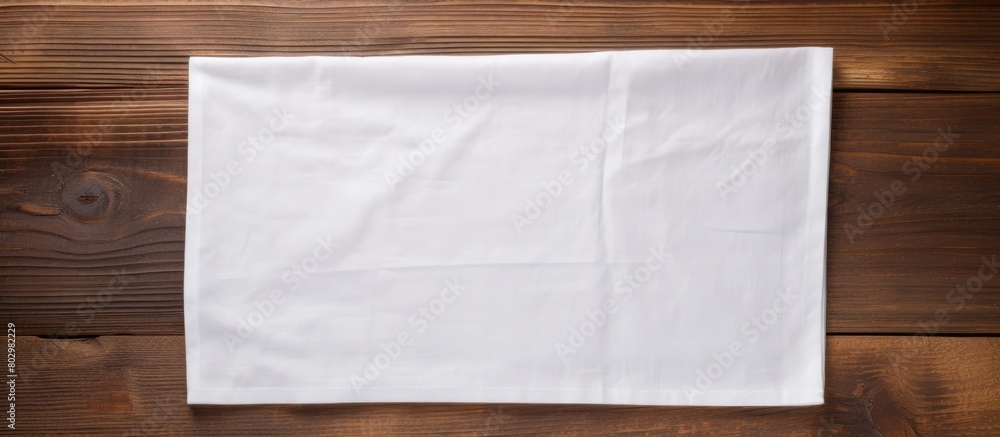 Poster a copy space image of a napkin placed on a rustic wooden background