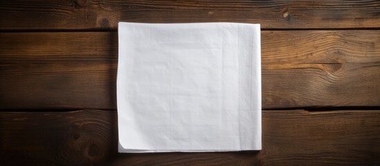 A copy space image of a napkin placed on a rustic wooden background