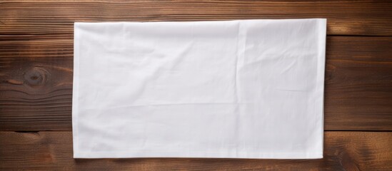 A copy space image of a napkin placed on a rustic wooden background