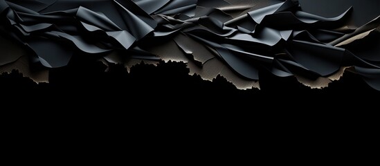 A black background showcases torn paper fragments providing ample copy space