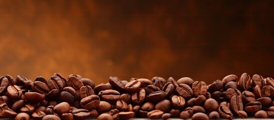 A brown background complements the warmth of roasted coffee beans creating a copy space image that promotes the concept of healthy products made with organic natural ingredients