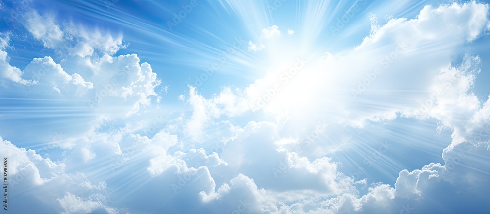 Aufkleber a copy space image of sunlight filtering through white clouds against a blue sky backdrop