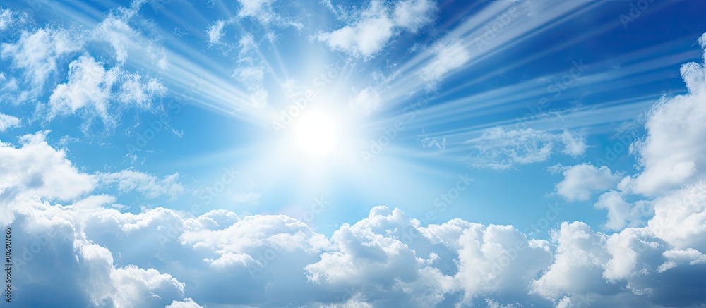 Poster a close up of a serene blue sky with sun rays and fluffy clouds perfect for a copy space image