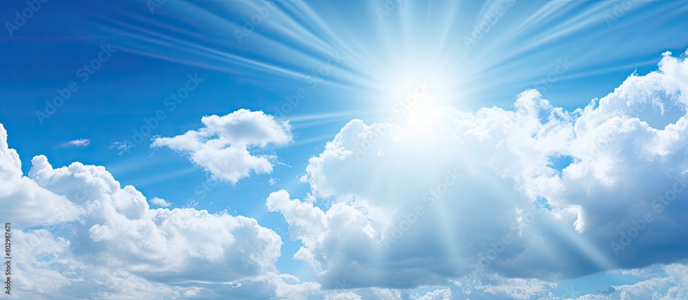 Poster a close up of a serene blue sky with sun rays and fluffy clouds perfect for a copy space image