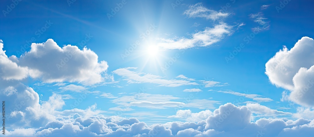 Poster a close up of a serene blue sky with sun rays and fluffy clouds perfect for a copy space image