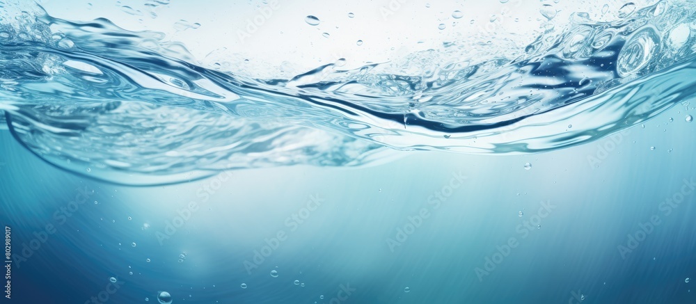 Poster A copy space image captures the mesmerizing dance of water droplets forming circles swirling splashing and creating ripples on a textured sea pattern