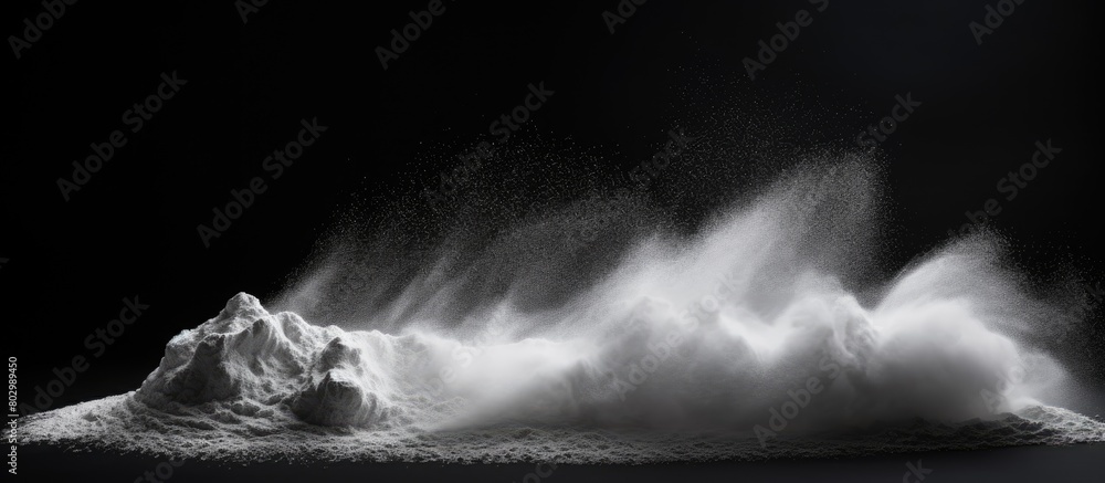 Poster a black background hosts a striking image of white chalk powder providing copy space for textures or