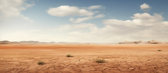 A barren expanse of arid ground with no vegetation resembling a vast desert Copy space image