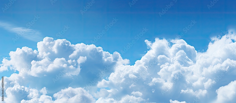 Poster a copy space image featuring clouds against a backdrop of a blue sky