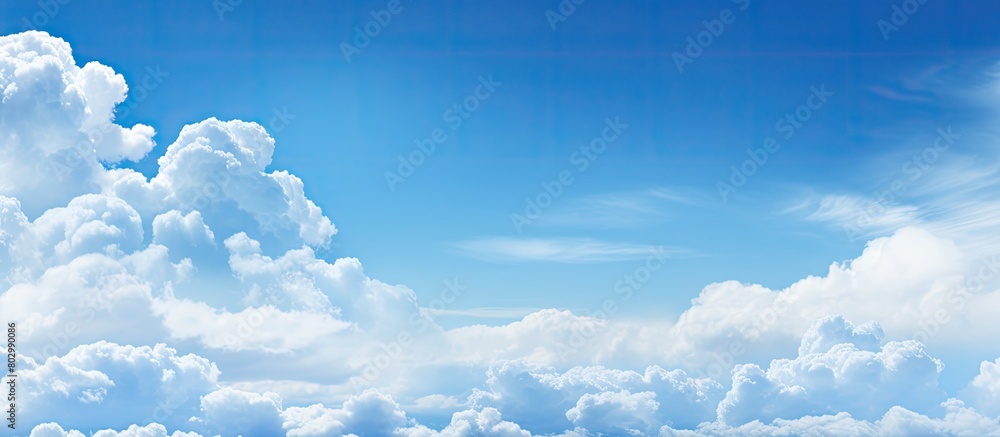 Poster a copy space image featuring clouds against a backdrop of a blue sky