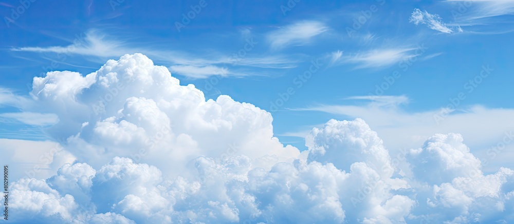 Poster a copy space image featuring clouds against a backdrop of a blue sky