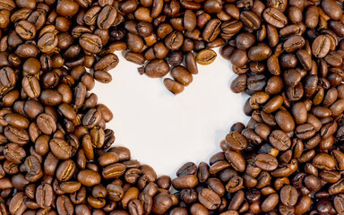 Heart shape of roasted Coffee beans isolate, white heart color 