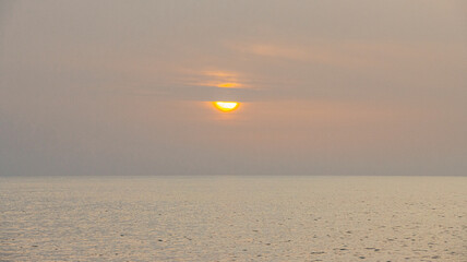 Foggy sunset on the beach with pastel colours