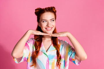 Photo of gorgeous girl with redhair tails dressed colorful blouse look empty space hands under chin...