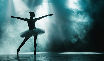 Graceful ballerina performing on stage with dramatic lighting