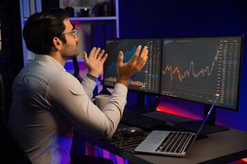 Smart trader businessman concentrating on dynamic stock exchange investment on pc and laptop...