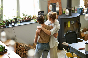 Lesbian couple in art studio.