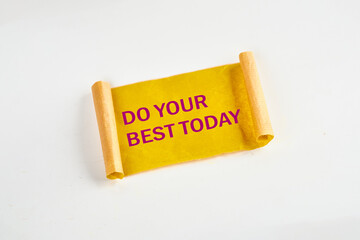 Business motivational. Do your best today symbol on yellow torn paper