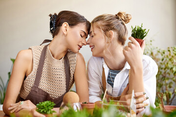 A tender moment between two women in an art studio.