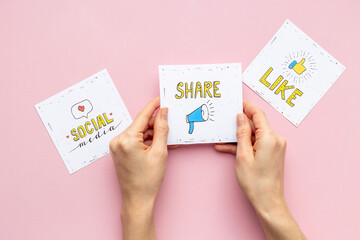 Hands holding Like and share icons for social media. Digital marketing concept